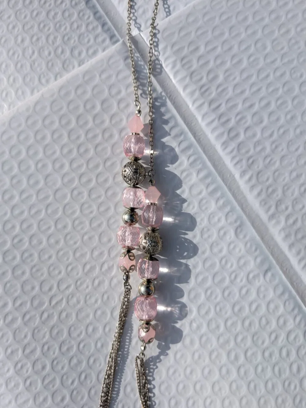 Light pink paparazzi necklace with matching earings set.